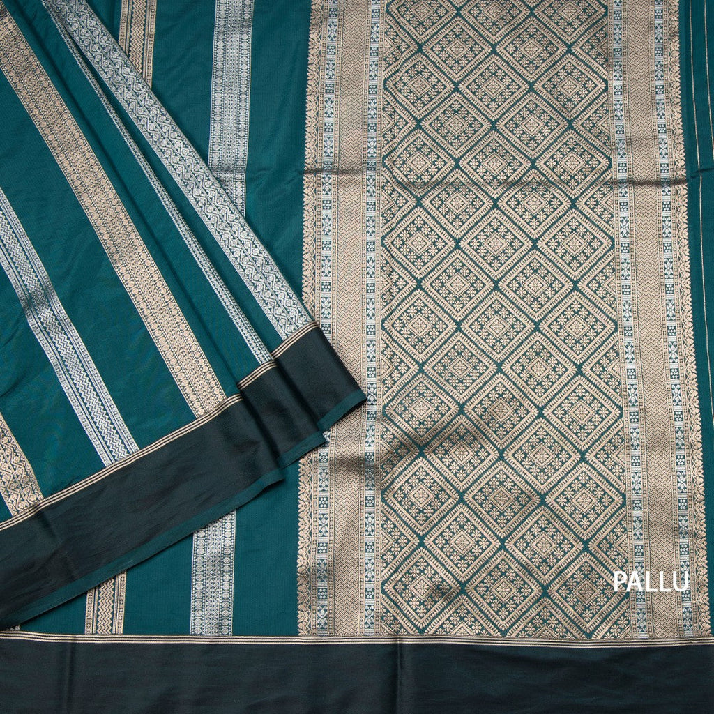 Raw Silk Teal Green Saree With Zari Stripes Design And Simple Border