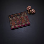 Raw Silk Black Floral Printed Saree With Paisley Border