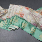 Raw Silk Light Green Floral Printed Saree With Zari Border