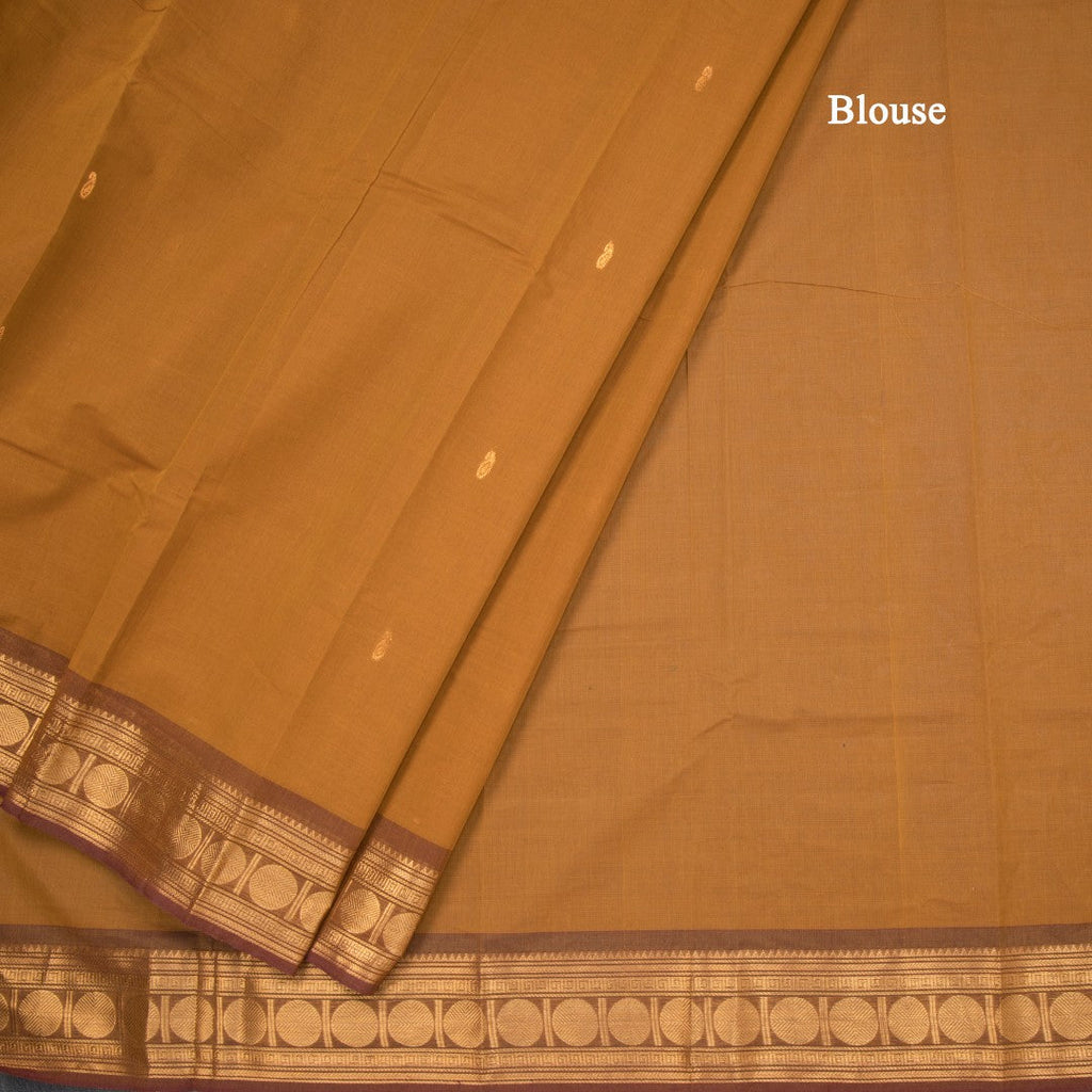 Kanchi Cotton Golden Brown Saree With Zari Buttas And Zari Border