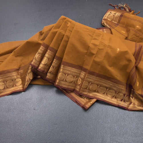 Kanchi Cotton Golden Brown Saree With Zari Buttas And Zari Border