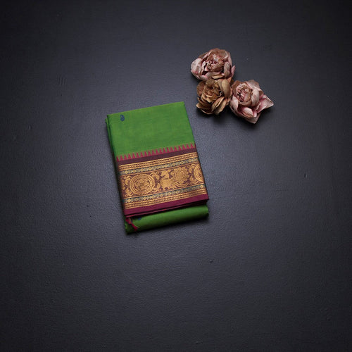 Kanchi Cotton Parrot Green Saree With Thread Buttas And Zari Border