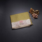 Raw Silk Mehandi Green Zari Checked Saree And Cut Work Border