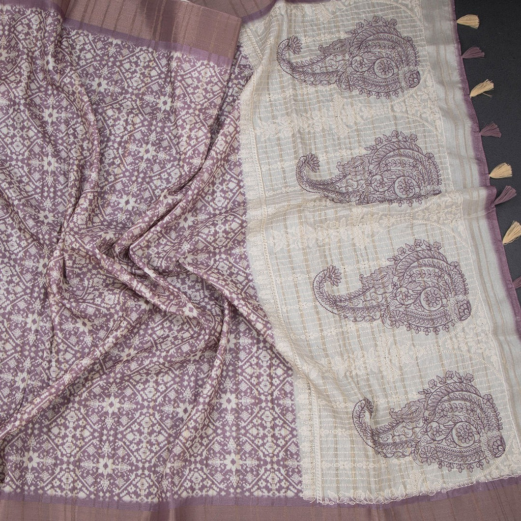 Raw silk purple printed saree with zari border from Shriyara Life, showcasing intricate print and elegant border details.