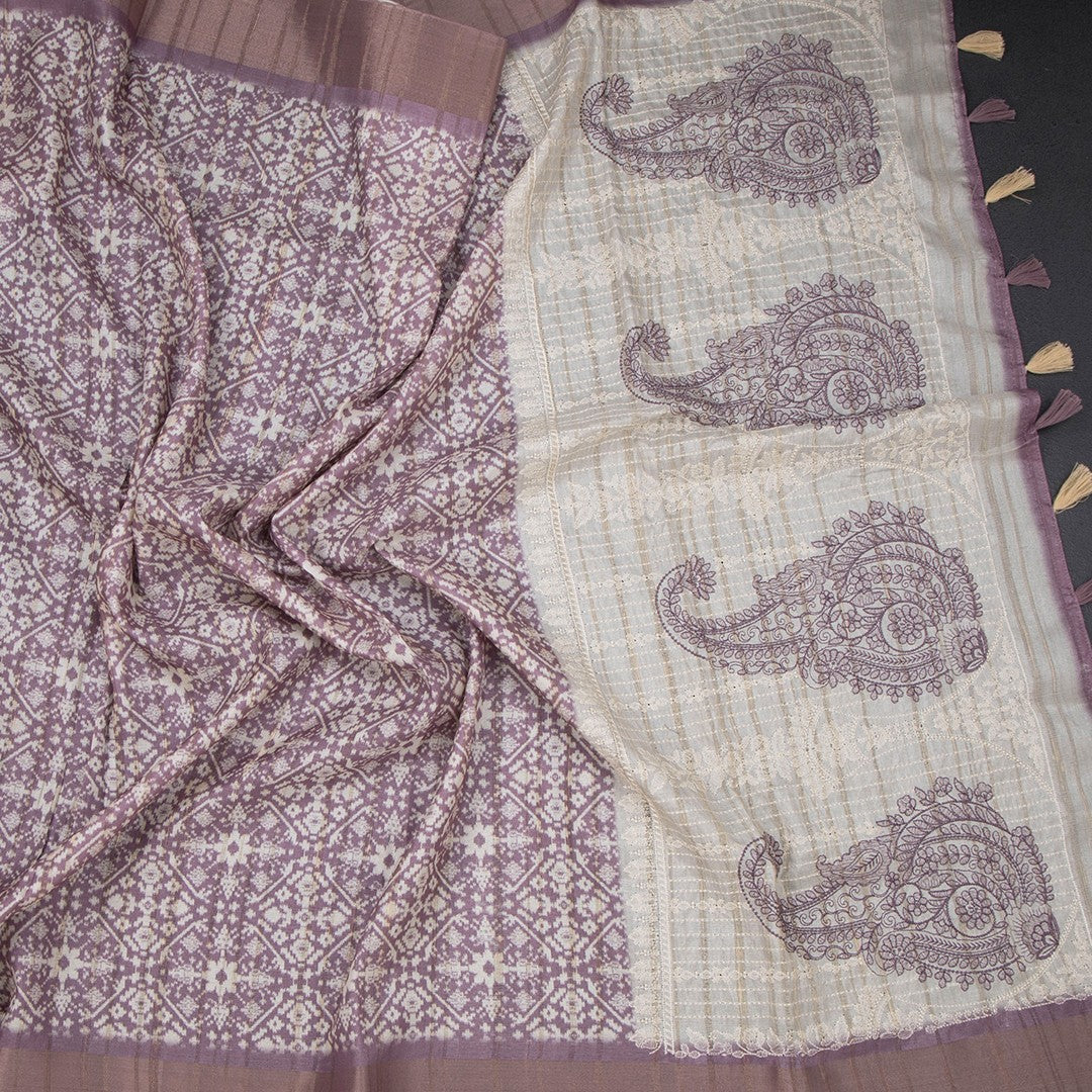 Raw silk purple printed saree with zari border from Shriyara Life, showcasing intricate print and elegant border details.