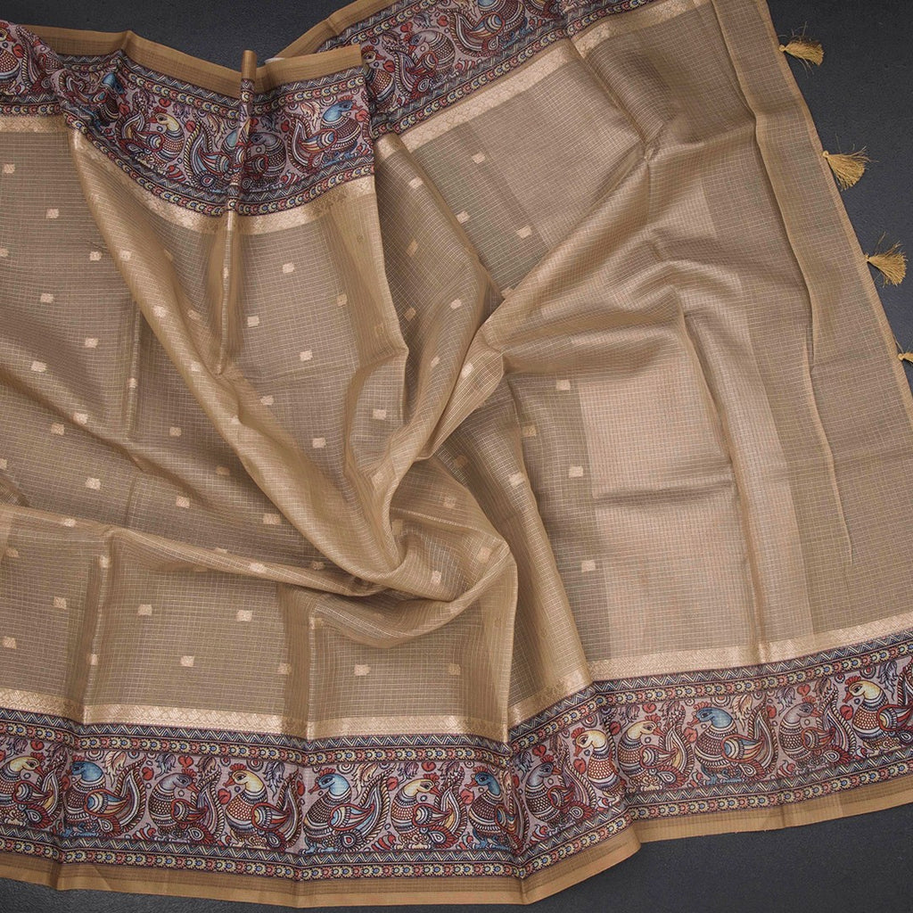 Kota gold saree by Shriyara Life featuring zari buttas and a printed border, displayed with intricate gold detailing.