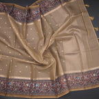 Kota gold saree by Shriyara Life featuring zari buttas and a printed border, displayed with intricate gold detailing.