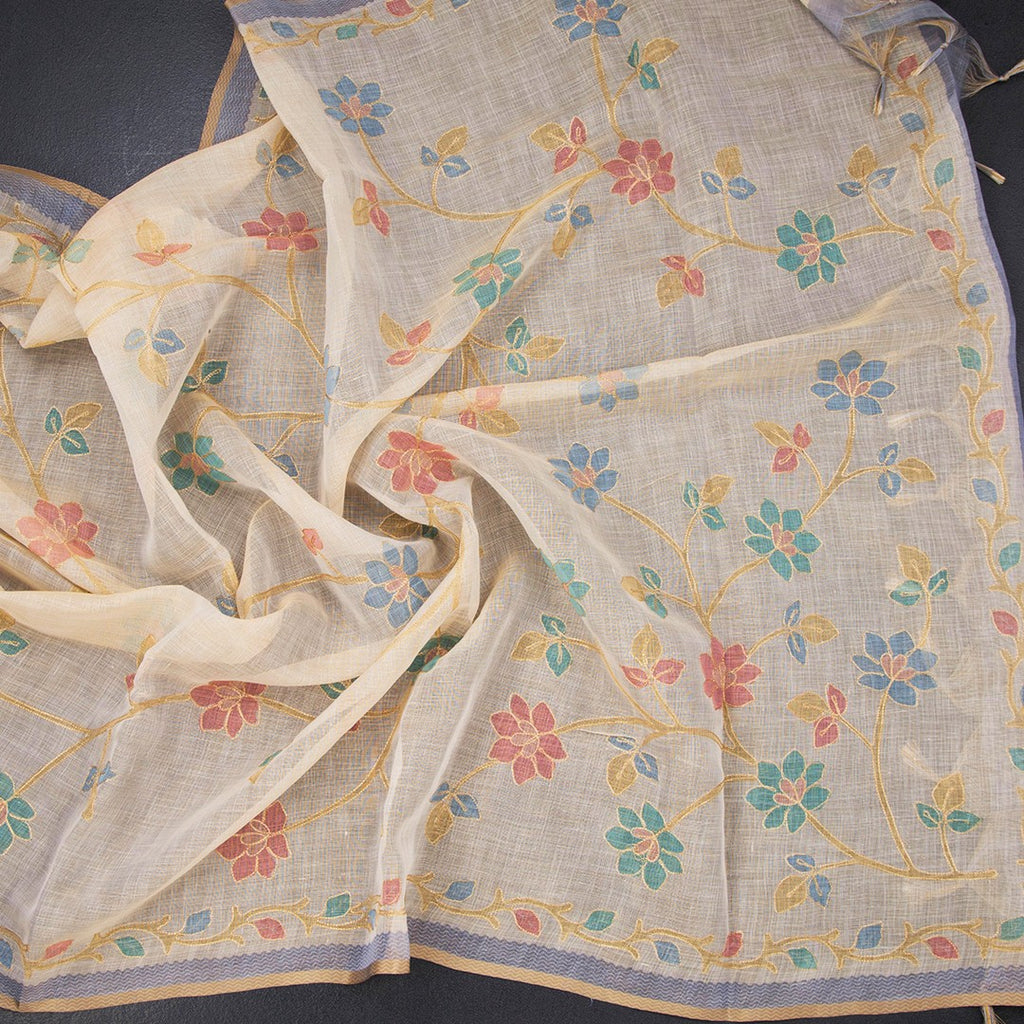 Linen cream saree with painted zari thread work, featuring intricate embroidery and elegant drape, by Shriyara Life.