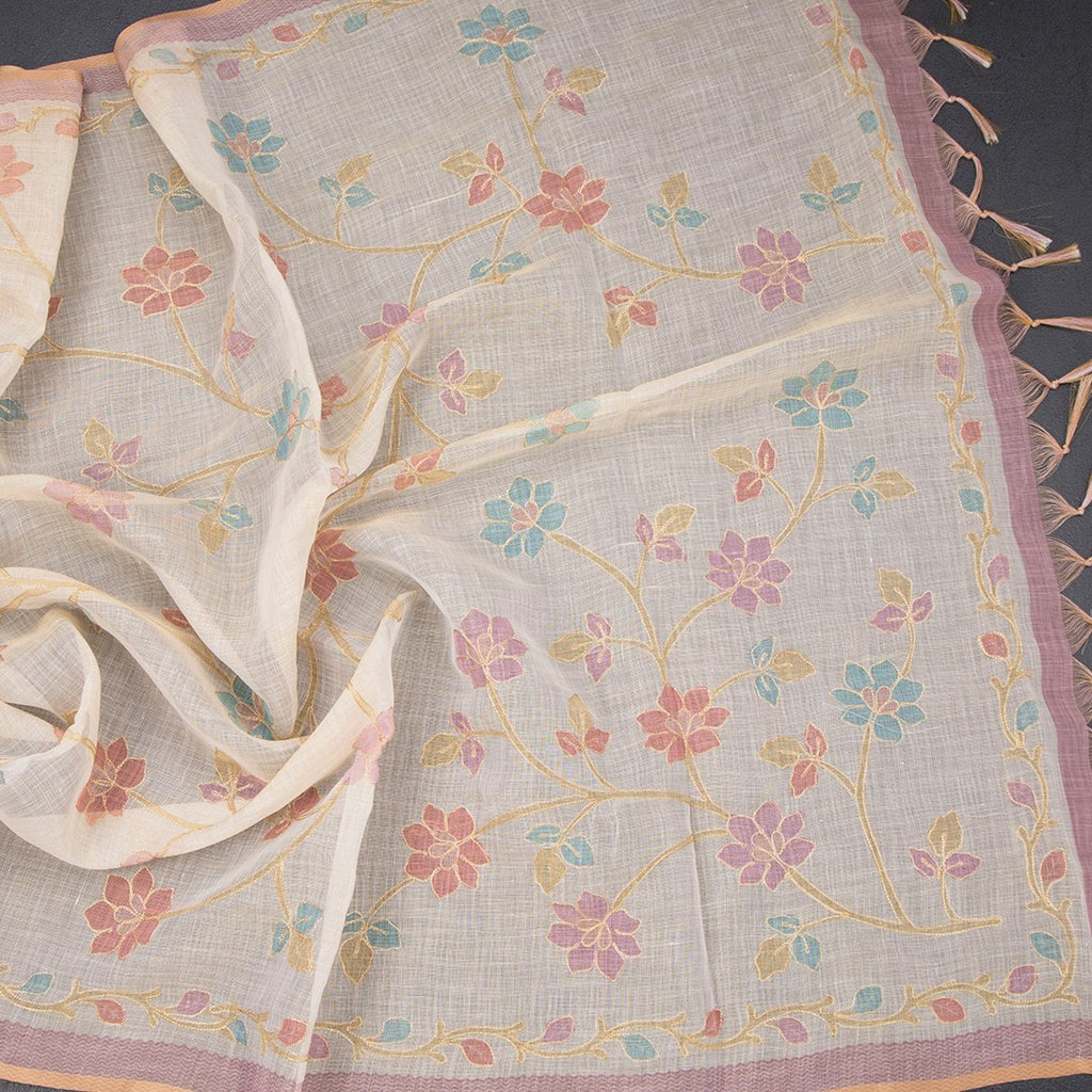 Linen cream saree with painted zari thread work by Shriyara Life, showcasing intricate embroidery and elegant drape.