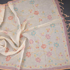 Linen cream saree with painted zari thread work by Shriyara Life, showcasing intricate embroidery and elegant drape.