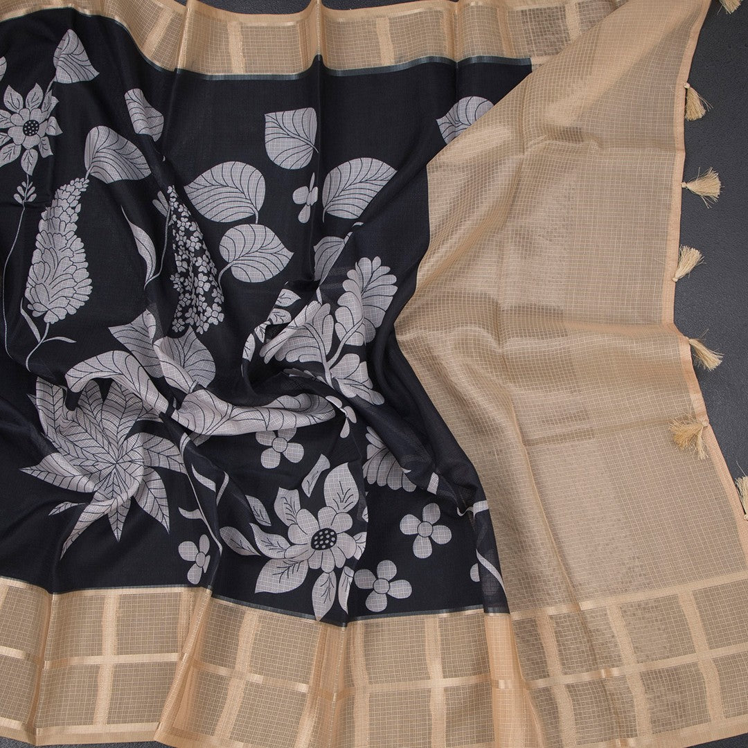 Kota black floral printed saree with zari checked border by Shriyara Life, featuring intricate floral and checkered designs.