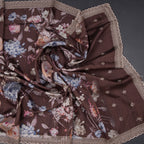 Dark brown raw silk saree with floral print and intricate thread cut work border, by Shriyara Life.