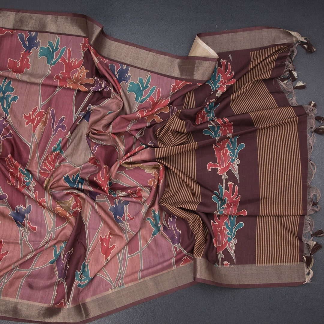 Pink raw silk saree with printed design and zari border from Shriyara Life, showcasing intricate patterns and elegant craftsmanship.
