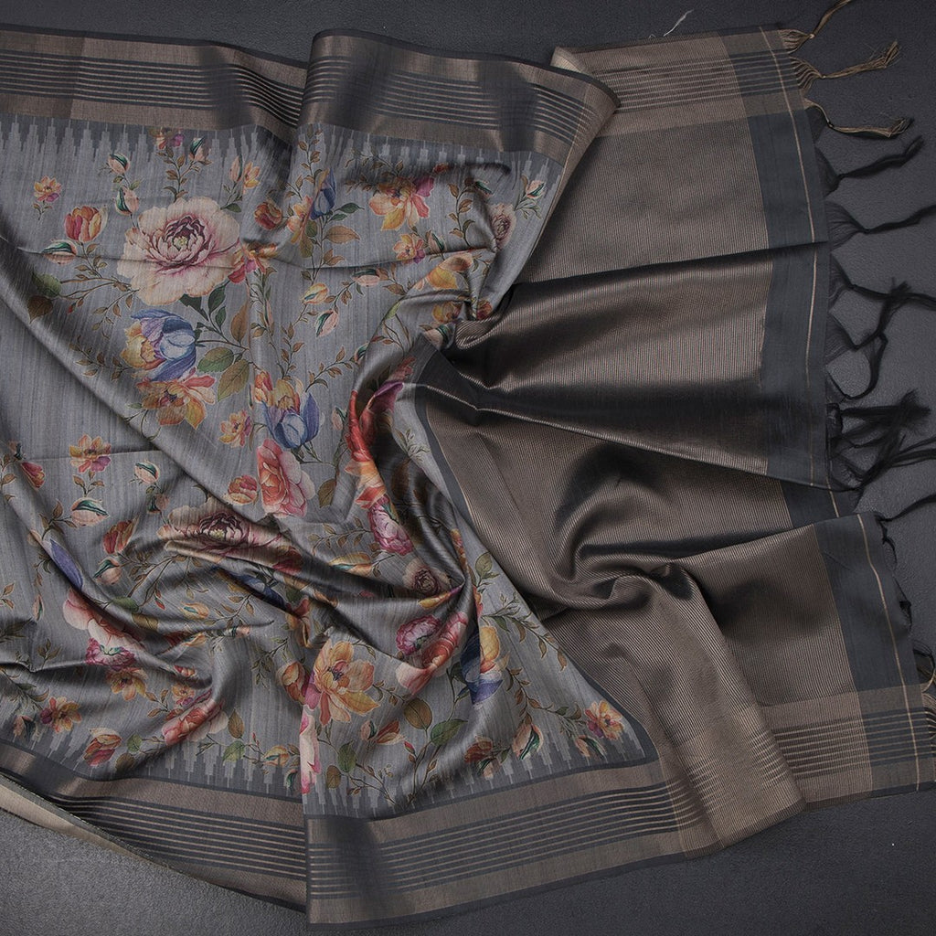 Raw silk saree in fossil grey with floral print and zari border by Shriyara Life, showcasing intricate design and elegant fabric.