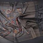 Raw silk saree in fossil grey with floral print and zari border by Shriyara Life, showcasing intricate design and elegant fabric.