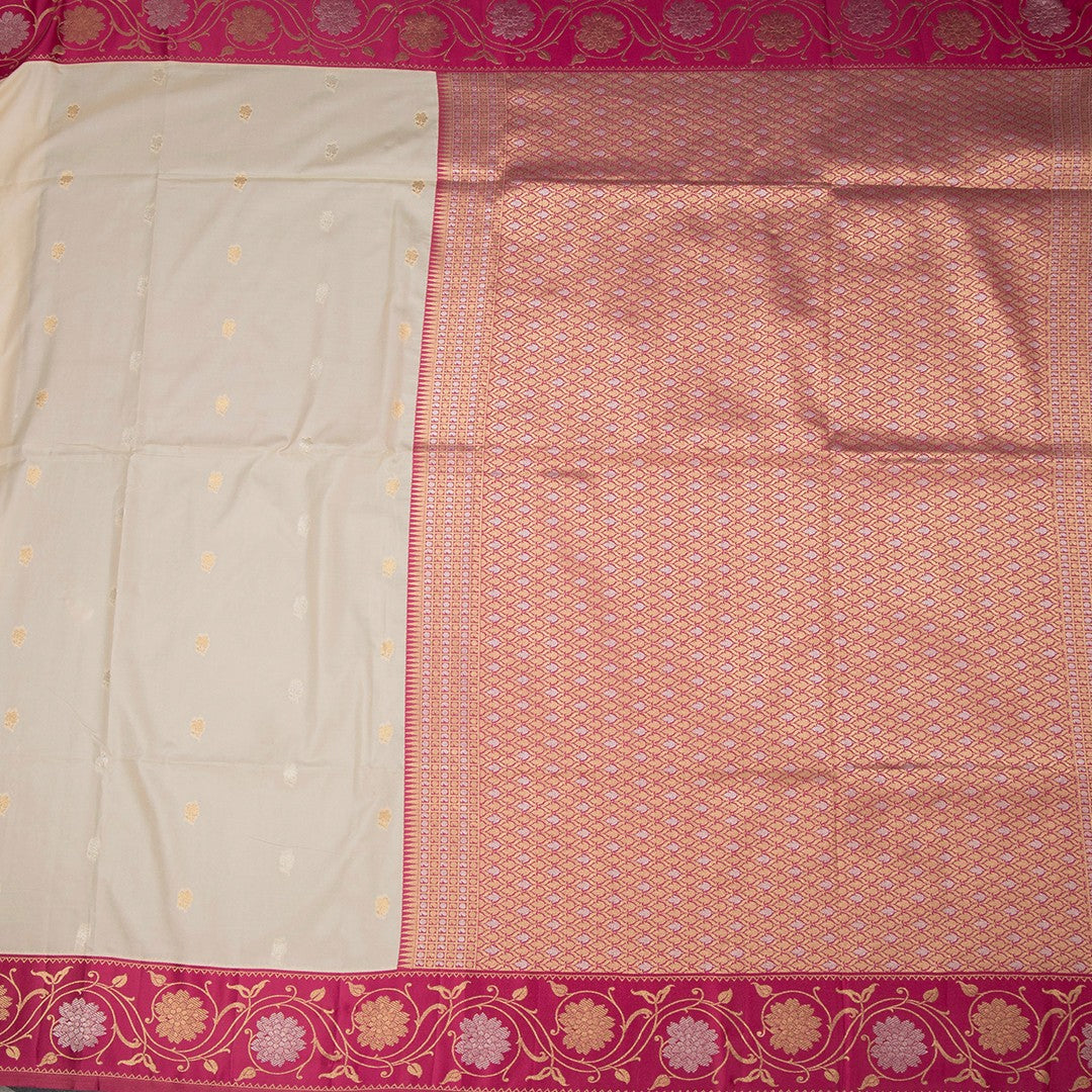 Art Silk Cream Saree With Zari Buttas And Floral Border