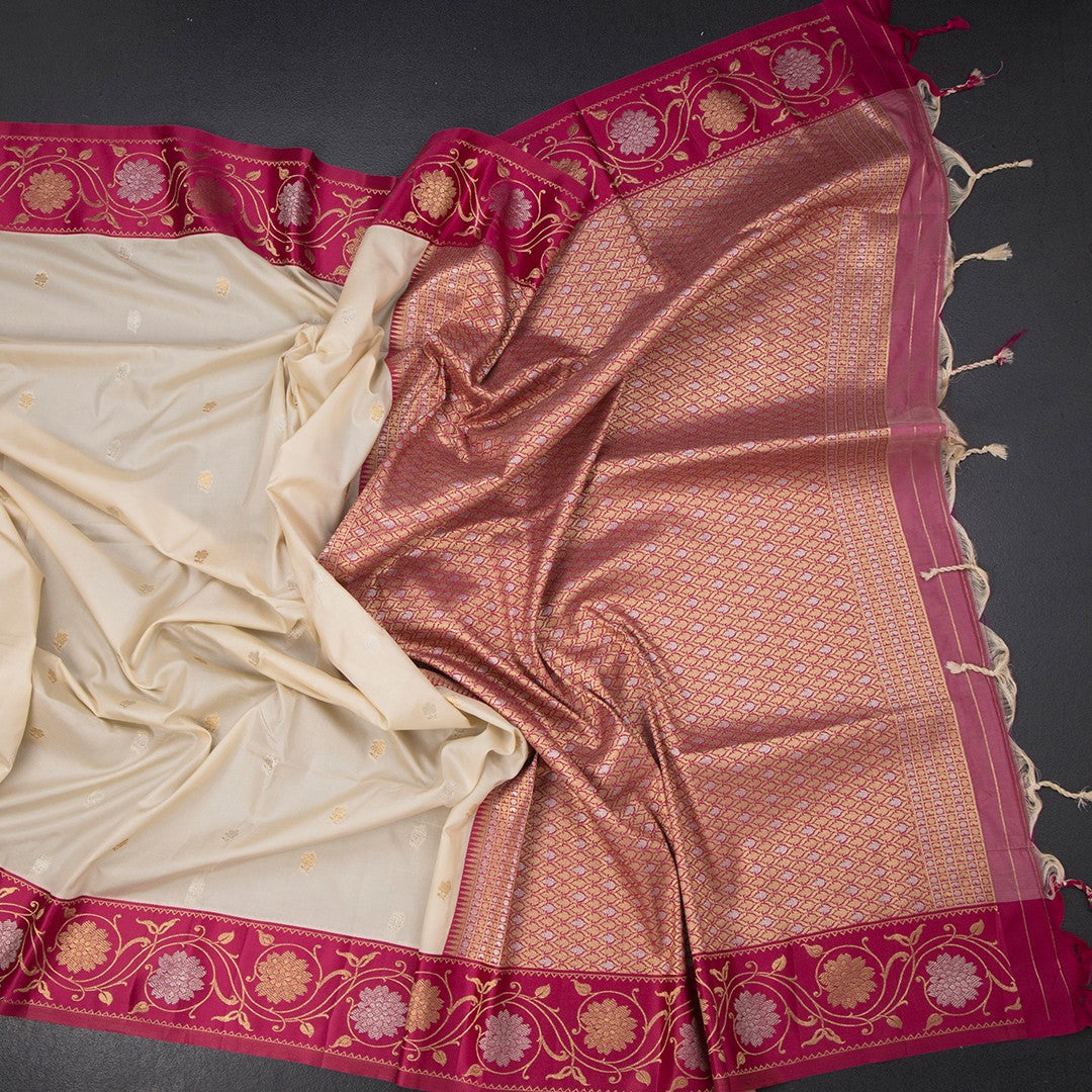 Art Silk Cream Saree With Zari Buttas And Floral Border