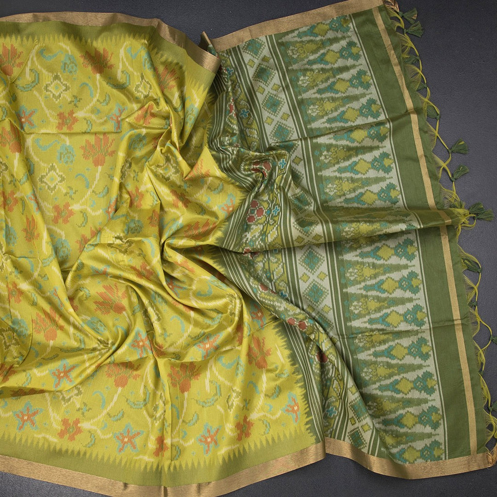 Lime green printed raw silk saree by Shriyara Life, showcasing intricate floral patterns and elegant drape.