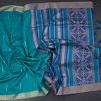 Raw silk peacock green saree with malli moggu design and zari border from Shriyara Life, showcasing intricate patterns and rich fabric.