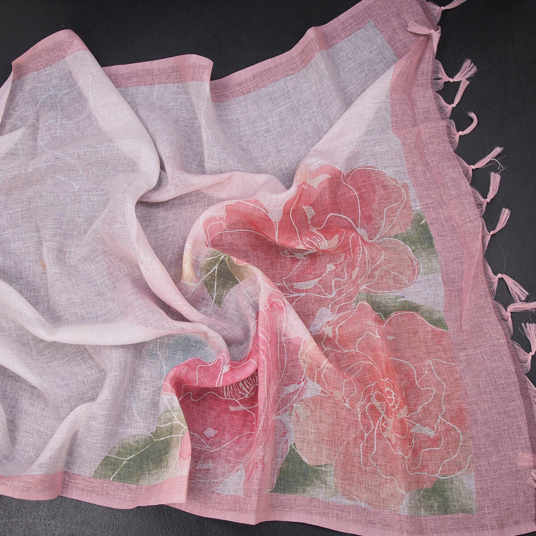 Light pink linen saree with borderless floral print from Shriyara Life, showcasing elegant fabric and vibrant floral design.