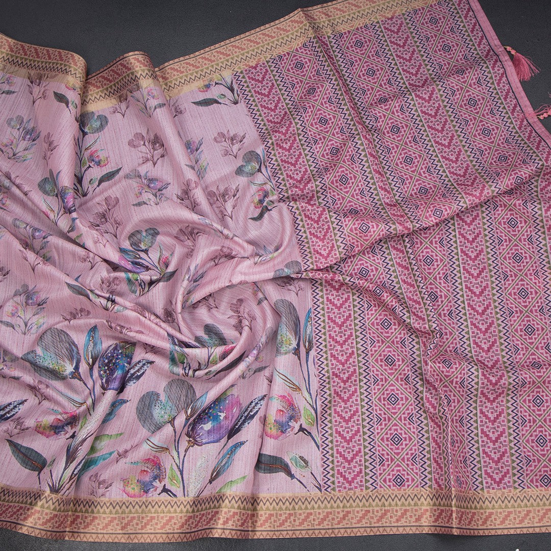 Semi raw silk saree with pink floral print by Shriyara Life, showcasing elegant taffy pink fabric and intricate floral design.