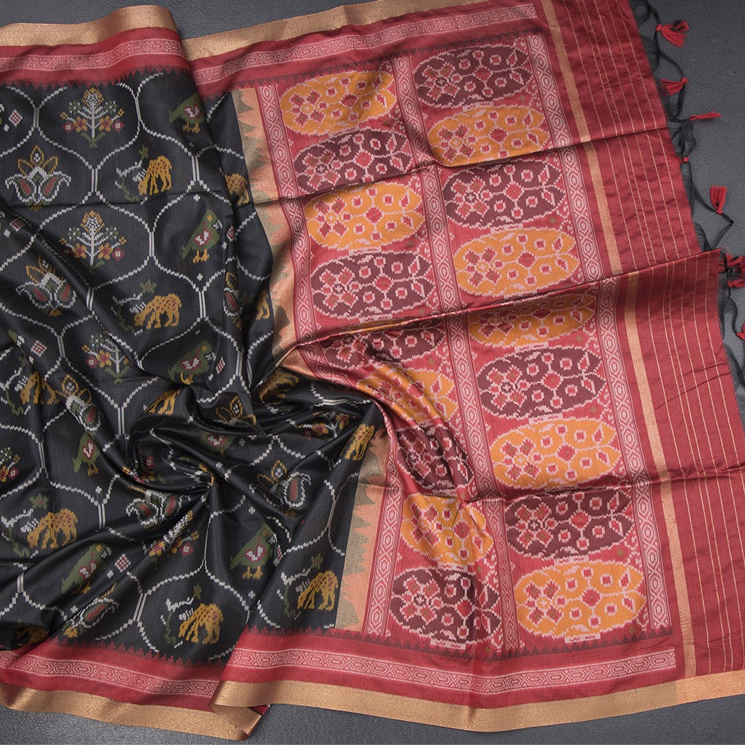 Black raw silk saree with intricate printed design from Shriyara Life, showcasing elegant traditional Indian attire.