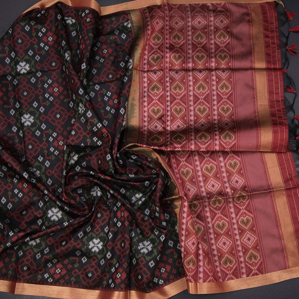 Black raw silk printed saree by Shriyara Life featuring intricate patterns and elegant drape.