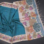 Peacock blue raw silk saree with zari checked pattern from Shriyara Life, showcasing intricate woven design and luxurious fabric.