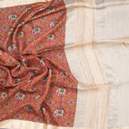 Raw silk orange printed saree from Shriyara Life, featuring traditional floral patterns and elegant drape.
