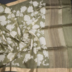 Pure Tussar Olive Green floral printed saree by Shriyara Life, showcasing intricate floral patterns and elegant drape.