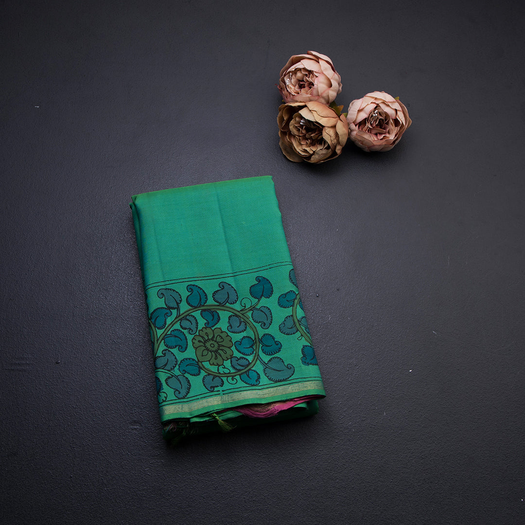 Peacock Green Plain Silk Saree With Hand Painted Kalamkari Design Border