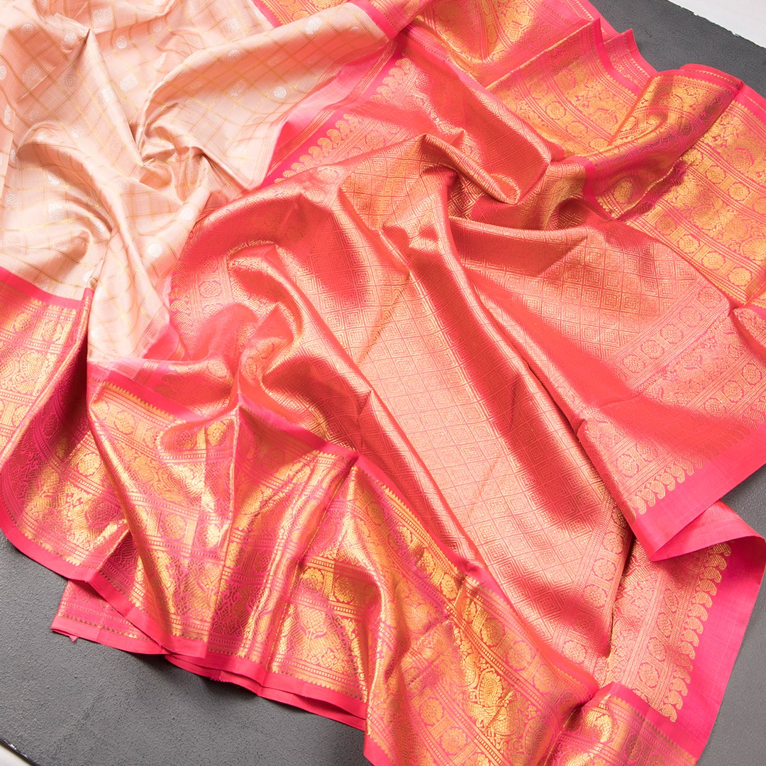 Pink Silk Saree With Peacock And Chakra Buttas On The Body With Yazhi Designed Red Border