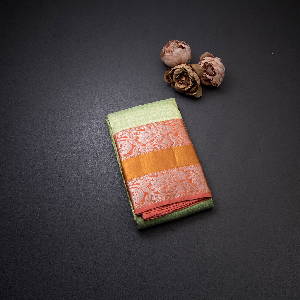 Light Green Self Designed Silk Saree With Orange Border And Gold And Silver Zari Work