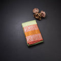 Light Green Self Designed Silk Saree With Orange Border And Gold And Silver Zari Work