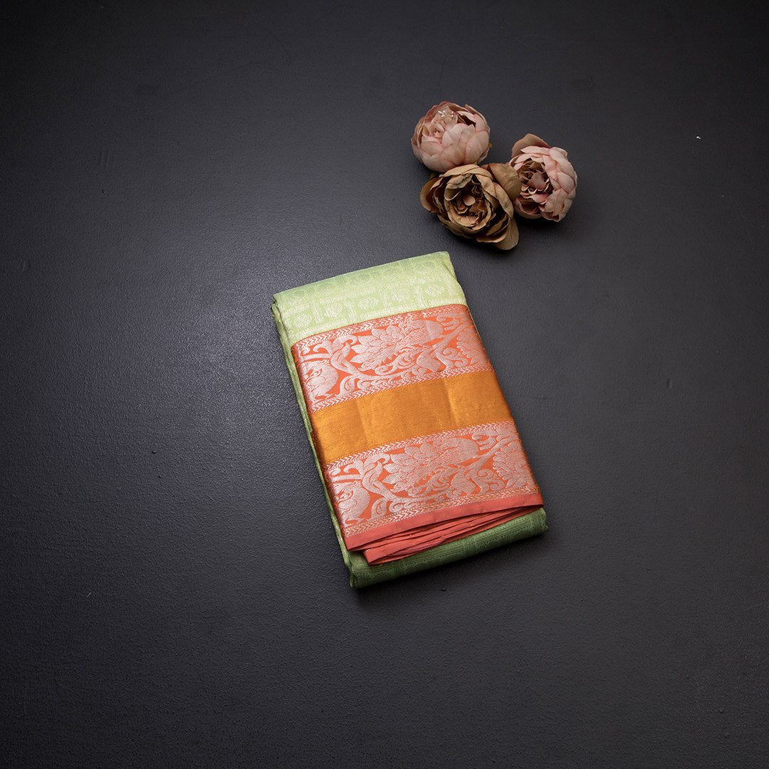 Light Green Self Designed Silk Saree With Orange Border And Gold And Silver Zari Work