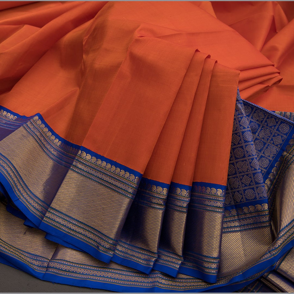 Plain Orange Kanchipuram Silk Saree With Contrasting Blue Border