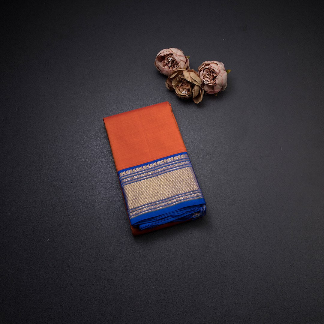 Plain Orange Kanchipuram Silk Saree With Contrasting Blue Border