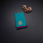 Borderless Turquoise Blue With Peacock Butta On Body With Contrast Pallu