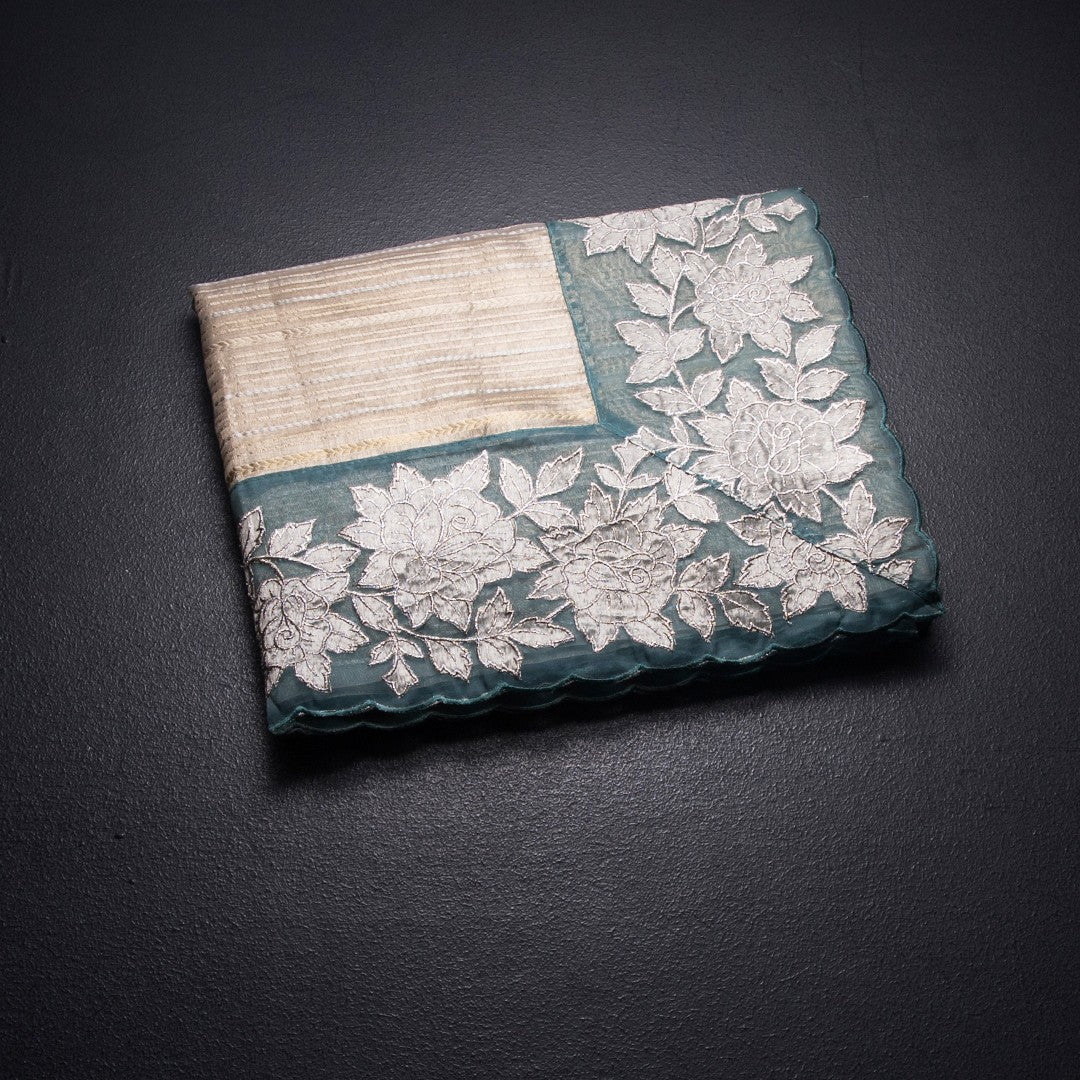 RTSR42362-1-Tissue-Cream-Zari-Stripes-Saree-And-Floral-Border-03-fold